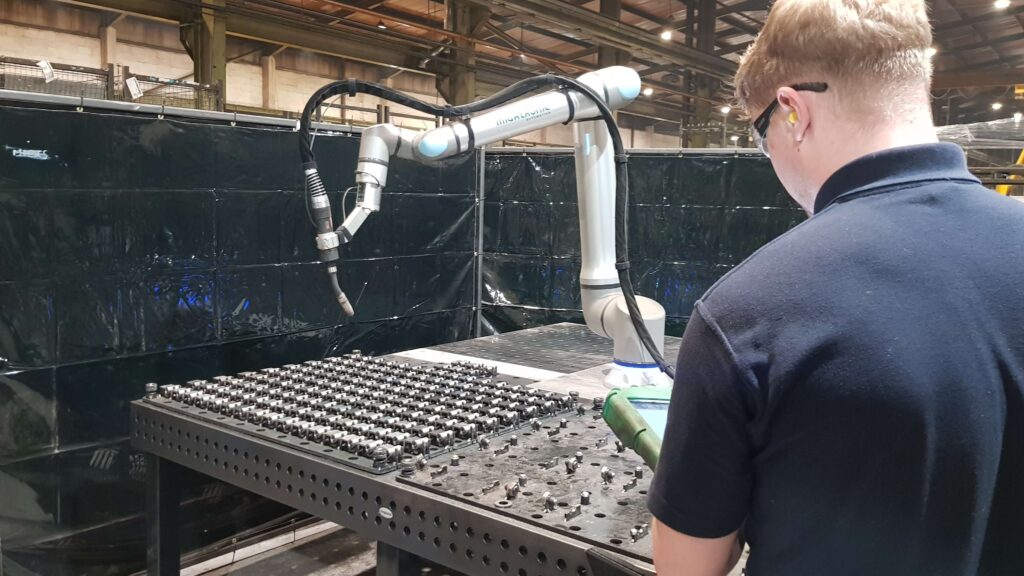 Nathan Younger with ADM Pressings cobot welding robot, Newcastle