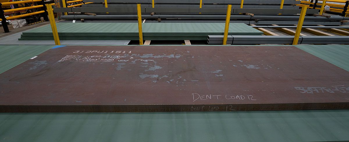 Dent Steel facility with steel plates on racking